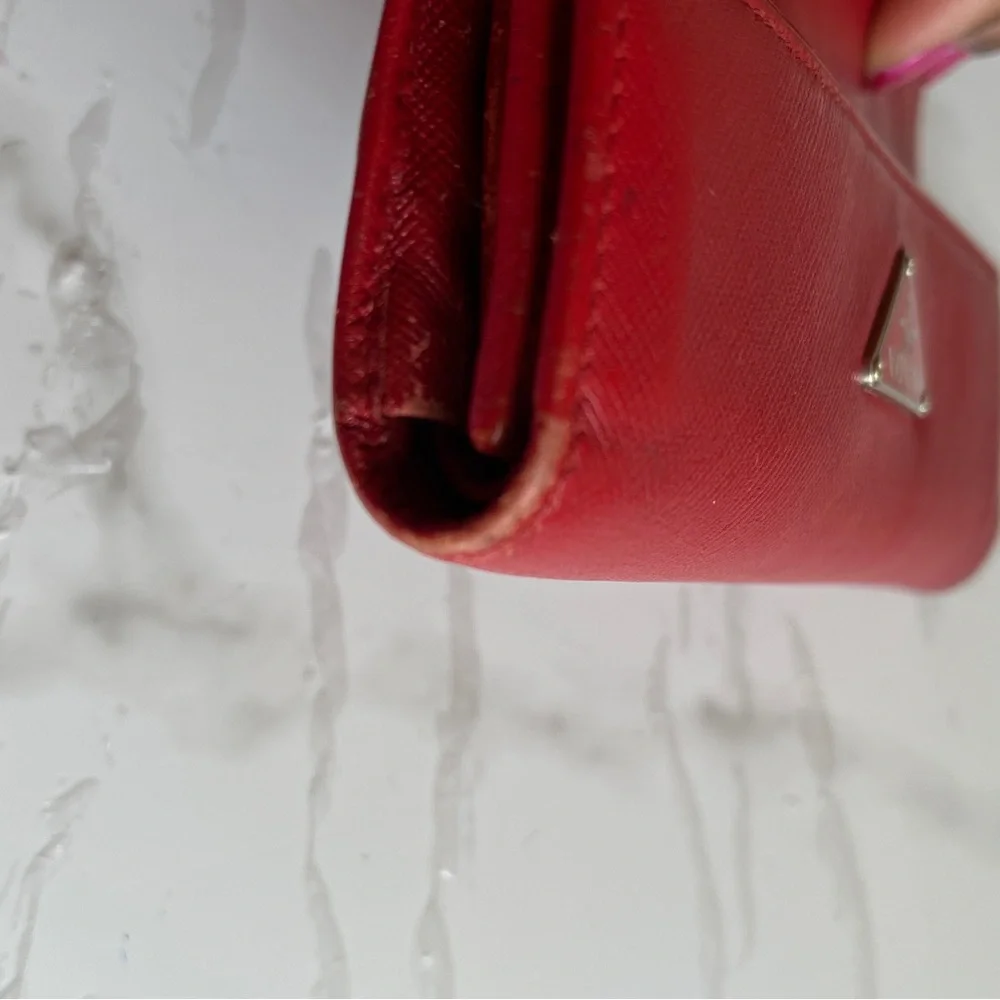 PRADA red Saffiano Leather Wallet. PRADA logo on flap. Preowned condition. - Picture 13 of 16